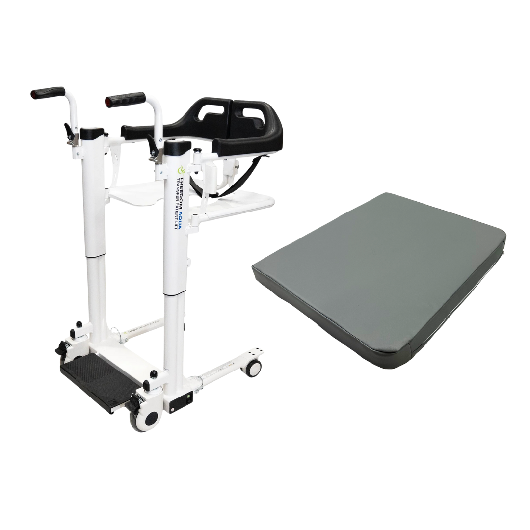 The Freedom Aqua Waterproof Powered Patient Lift – Sling Free Transfers, a white lift with handles, wheels, and a foot platform, is positioned next to a gray rectangular cushion or mat.